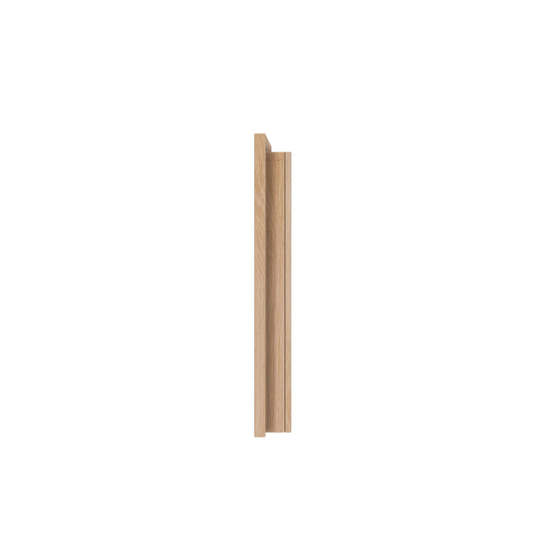 Vertical natural oak wood trim molding profile with groove for interior door jamb or picture frame on white background