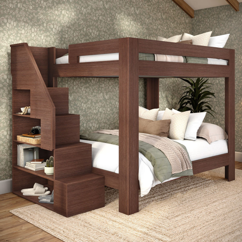 Dark wood bunk bed with built-in storage staircase, cozy linens and pillows, green floral wallpaper — space-saving modern bedroom design