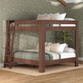 Walnut solid-wood twin-over-full bunk bed with ladder, green quilted bedding, neutral throw pillows, floral wallpaper and jute rug in modern bedroom