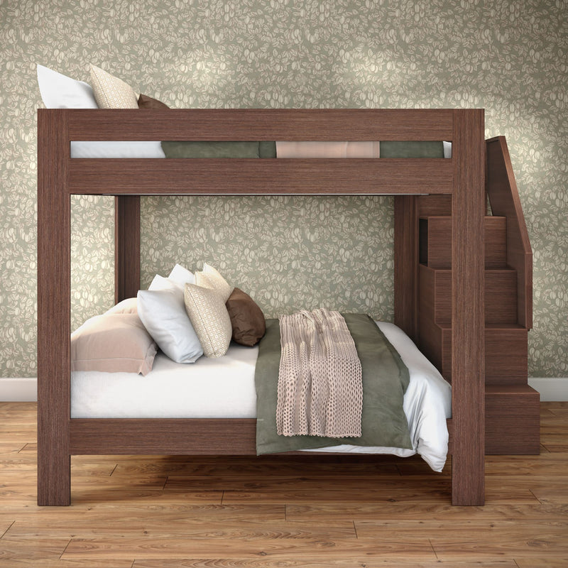 Brown wooden bunk bed with built-in staircase, cozy neutral bedding, floral wallpaper and hardwood floors