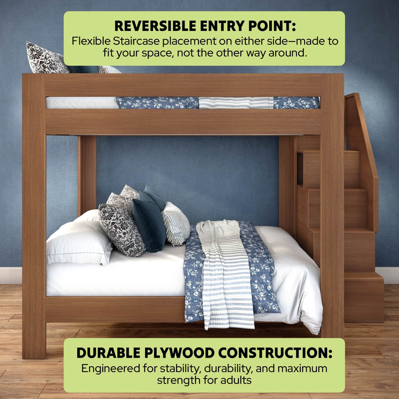 Modern wooden twin-over-full bunk bed with built-in staircase on the right, reversible entry point and durable plywood construction for adult strength, styled with blue floral and striped bedding and decorative pillows against a textured blue wall on hardwood floors