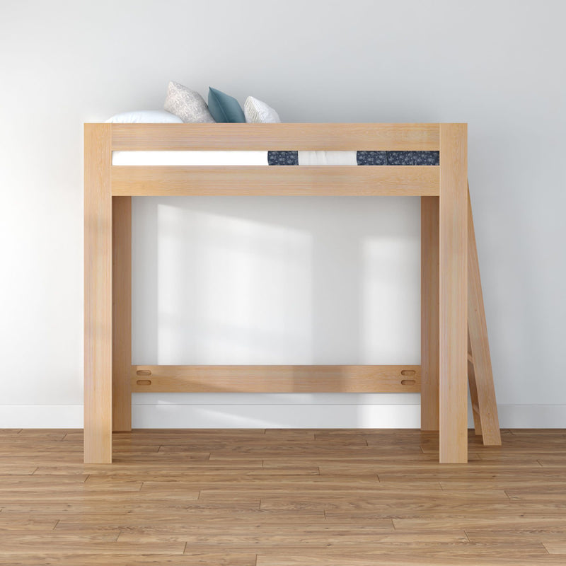 Natural wood loft bed with ladder, mattress and pillows against a white wall on hardwood floor — modern space-saving minimalist bed