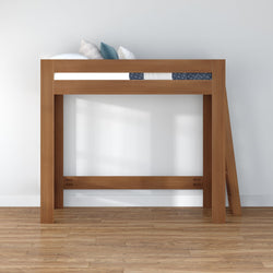 Modern solid wood loft bed with angled ladder, twin mattress and decorative pillows in a minimalist room on hardwood floor, space-saving elevated bed