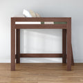 Dark walnut wooden twin loft bed with guardrail and side ladder over open space for desk or storage, modern raised bed frame on hardwood floor