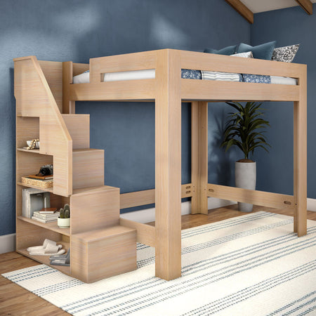 Modern light-wood loft bed with built-in storage stairs and shelving — space-saving kids' bedroom design with blue accent wall, striped area rug and potted plant