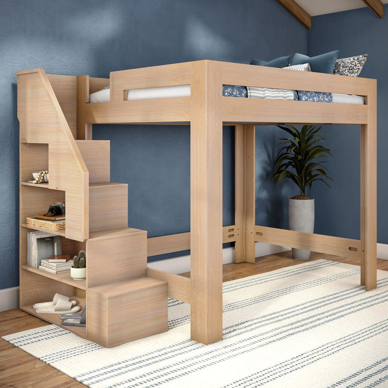 Modern light-wood loft bed with built-in storage stairs and shelving — space-saving kids' bedroom design with blue accent wall, striped area rug and potted plant