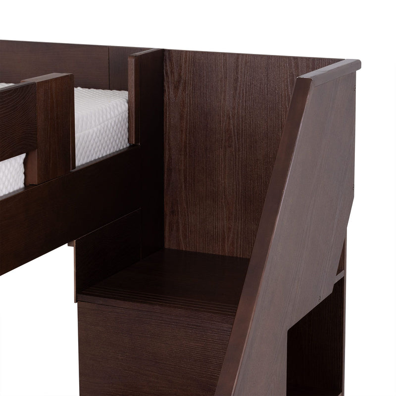 Close-up of dark brown wooden bunk bed side panel with ladder and guardrail, white mattress edge and textured wood grain — modern kids' bedroom furniture