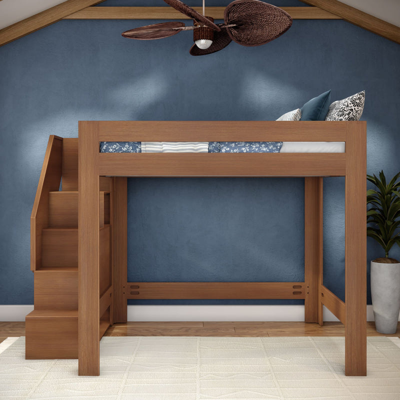 Solid wood loft bed with built-in staircase and storage drawers in a modern kids' bedroom with blue textured wall, ceiling fan and potted plant