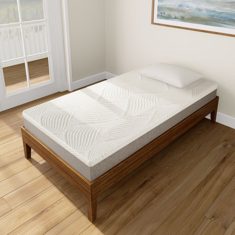 Single bed with a modern wooden frame and white mattress in a bright, cozy bedroom.