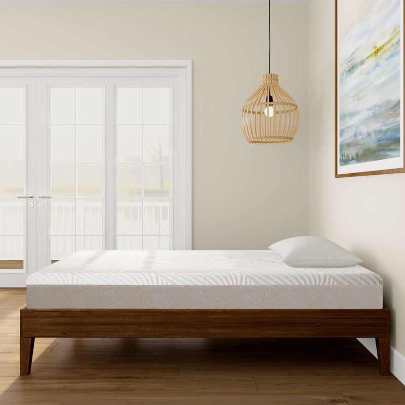Modern bedroom with a minimalist wooden bed frame, memory foam mattress, and stylish pendant light.