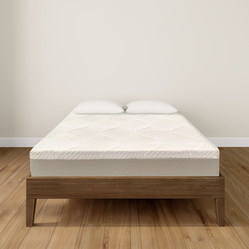 Modern wooden bed frame with a comfortable mattress and two pillows in a minimalist bedroom setting.