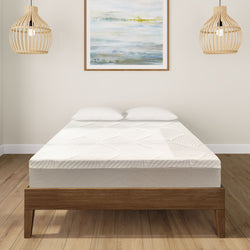 Modern bedroom with a comfortable mattress on a wooden bed frame and elegant pendant lights.