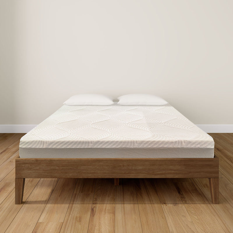 Queen-size bed with wooden frame and comfortable mattress on polished hardwood floor.