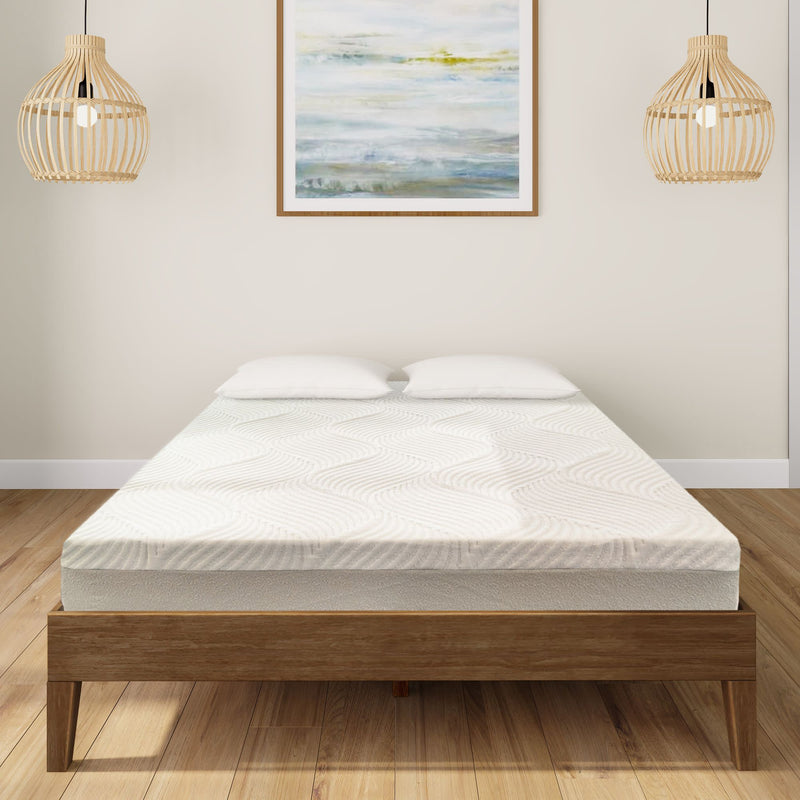 Stylish modern bedroom with a comfortable memory foam mattress on a wooden bed frame, complemented by chic pendant lighting and a serene landscape artwork.
