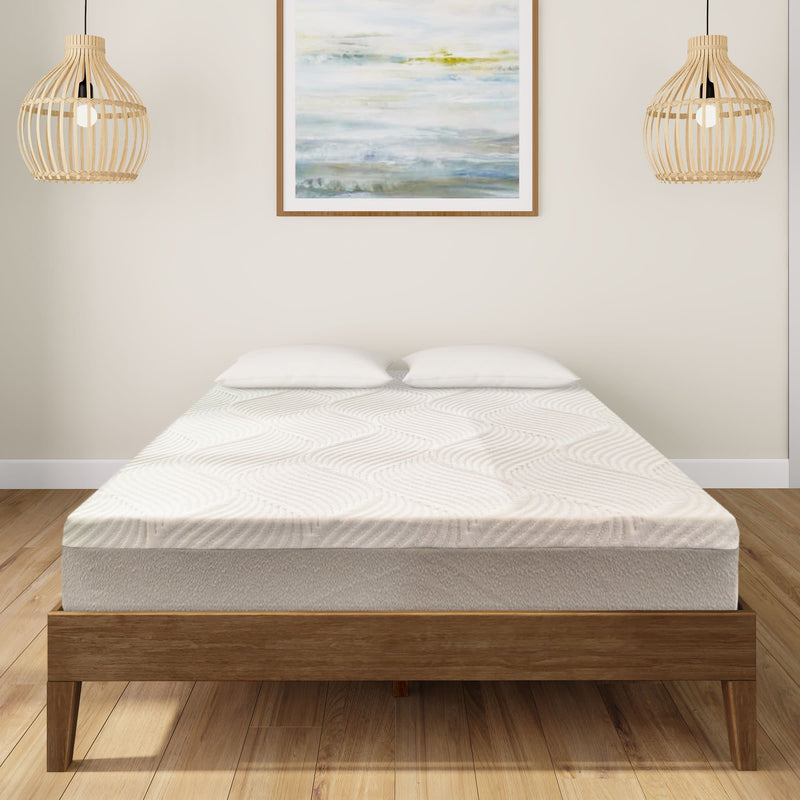 Modern bedroom with wood bed frame and comfortable mattress, featuring abstract wall art and hanging pendant lights.