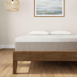 Modern minimalist bedroom with a comfortable bed, wooden frame, two pillows, and elegant wall art.