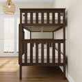Dark wood bunk bed in a bright room with hardwood flooring and modern lighting.