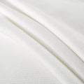 White textured fabric with subtle patterns, ideal for sewing, quilting, and crafts.