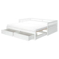 White wooden daybed with two large under-bed storage drawers, slatted backrest and frame, and full-size mattress in minimalist Scandinavian style