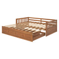 Wooden daybed frame with slatted platform and built-in under-bed storage drawers in warm oak finish