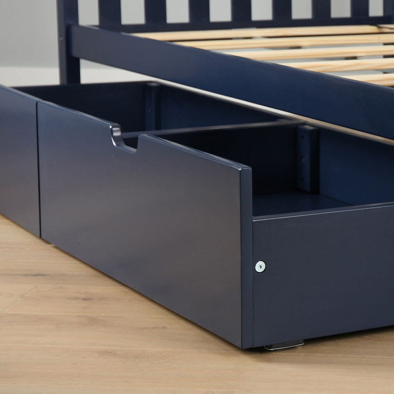 Navy blue bed with built-in under-bed storage drawer and wooden slats on hardwood floor — space-saving bedroom furniture
