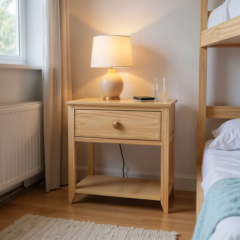 Cozy bedroom setting with a wooden nightstand, modern table lamp, and water glass.