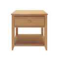 Wooden bedside table with drawer and shelf for bedroom storage solutions.