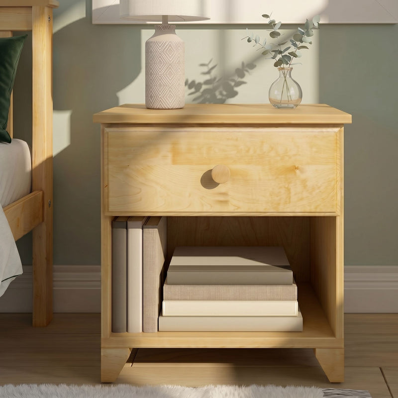 Minimalist wooden nightstand with natural wood finish, patterned ceramic table lamp and glass vase with eucalyptus in modern bedroom