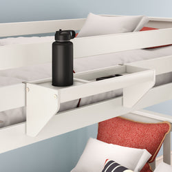 Black water bottle on a white bed shelf attached to a bunk bed with red and white pillows.