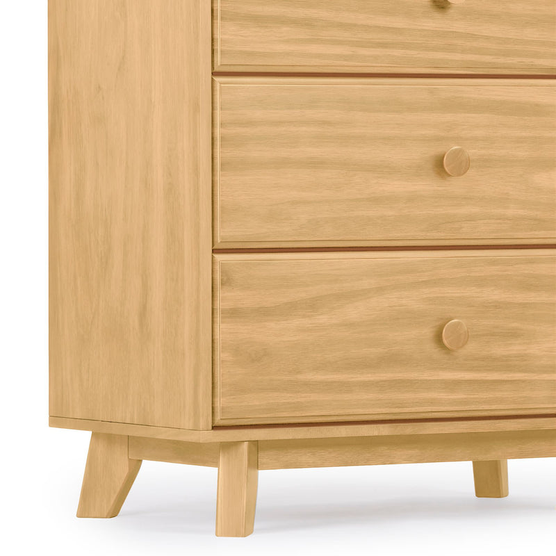 Light oak mid-century modern wooden dresser corner with two drawers, round wooden knobs and tapered angled legs for bedroom storage