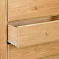 Light oak dresser with one open drawer, natural wood grain finish, round wooden knobs and visible metal drawer slides — bedroom chest of drawers for storage