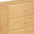 Light oak three-drawer wooden dresser with round knobs, modern minimalist bedroom storage chest