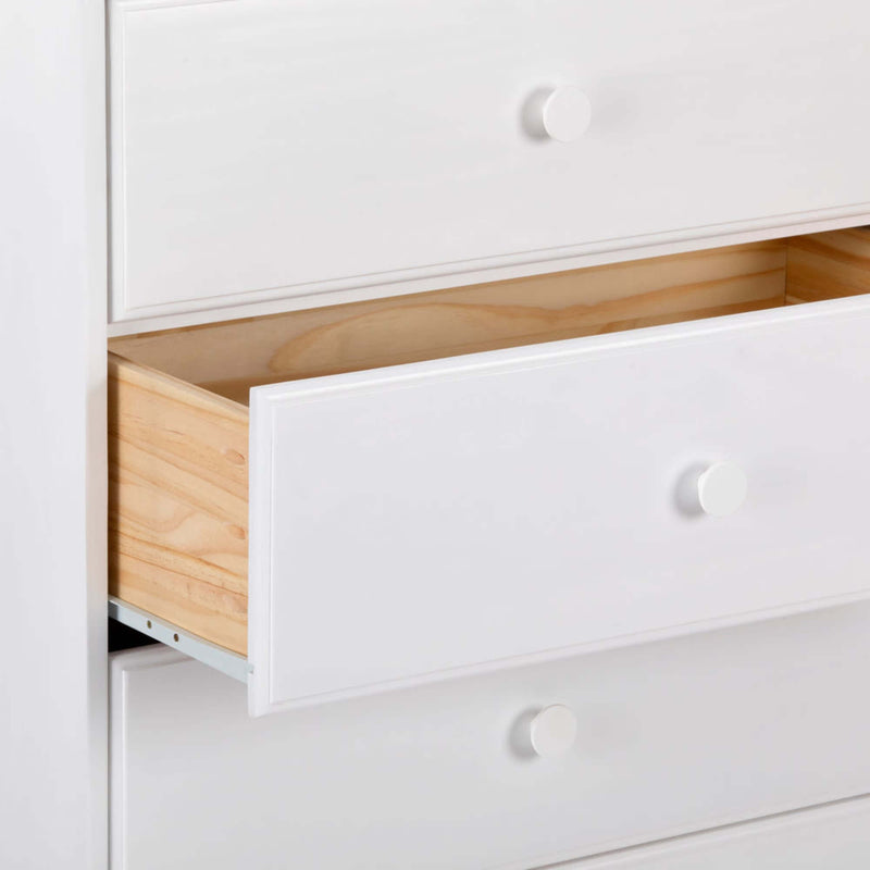 White dresser with partially open drawer revealing natural wood interior and round white knobs, modern bedroom storage chest of drawers