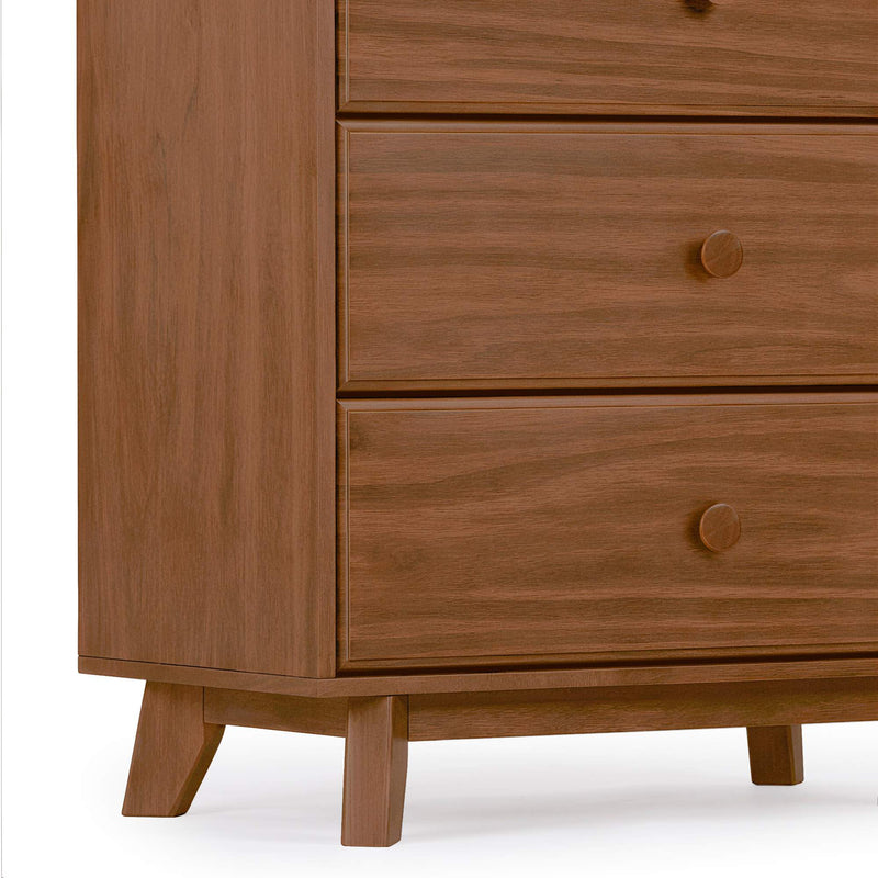 Mid-century modern walnut three-drawer dresser with round wooden knobs and tapered legs, bedroom storage