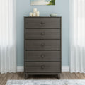 Gray five-drawer wooden dresser (tall chest of drawers) in light-blue bedroom with white curtains, hardwood floor, and decorative candles and bowl on top — mid-century modern storage furniture