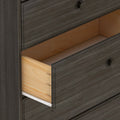 Open dark wood dresser drawer showing interior construction.