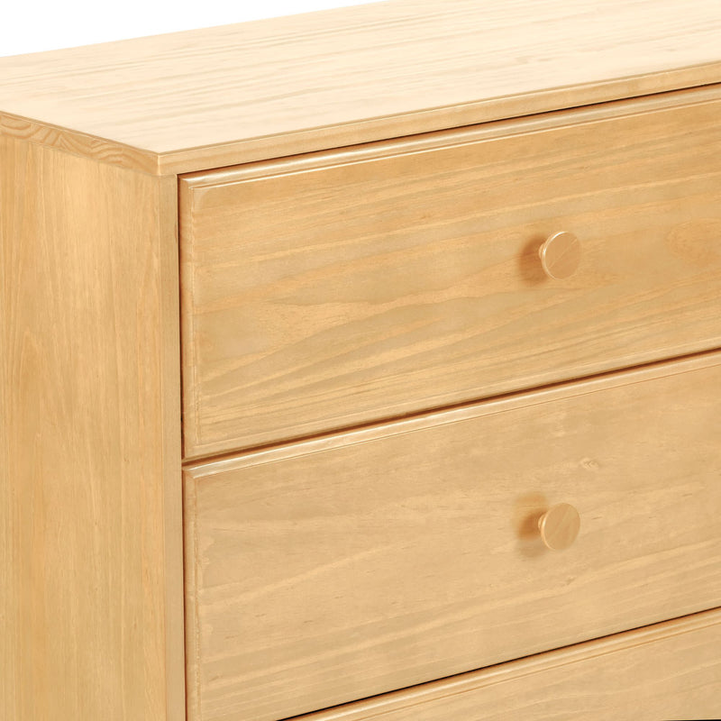 Light natural pine three-drawer dresser with round wooden knobs and smooth wood grain finish, minimalist bedroom storage chest