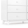 White mid-century modern wooden dresser with three drawers, round knobs and tapered legs, minimalist white bedroom storage cabinet