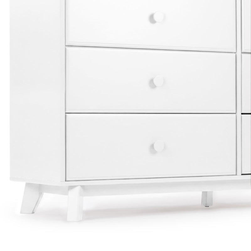 White mid-century modern wooden dresser with three drawers, round knobs and tapered legs, minimalist white bedroom storage cabinet