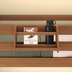 Wooden bed shelf with a book titled "The Old Man and the Sea" and a black water bottle.