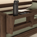 Wooden bed shelf with water bottle and smartphone, ideal for bedroom organization and storage.