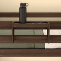 Wooden bedside shelf with a black water bottle and phone, perfect for bedroom organization.