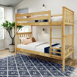 Wooden twin bunk bed in modern bedroom with plant and blue patterned rug.