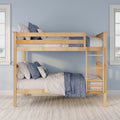 Natural wood bunk bed with ladder, blue and white bedding and pillows against a pale blue wall in a bright bedroom
