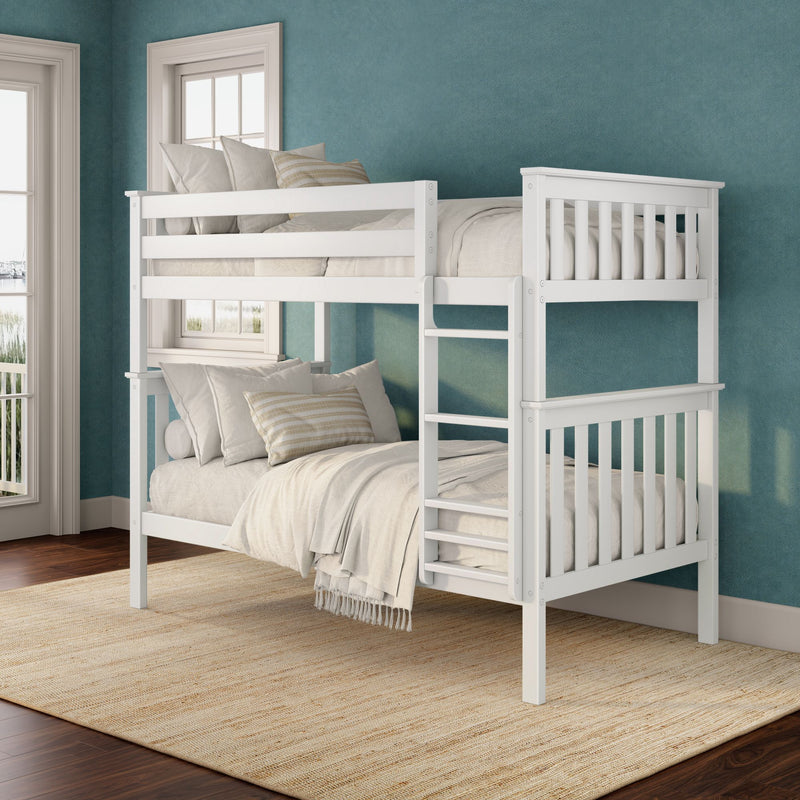White wooden bunk bed with ladder and neutral bedding in a coastal‑inspired bedroom featuring a teal textured wall, large windows and a natural jute area rug