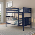 Navy blue wooden twin-over-twin bunk bed with ladder and light blue bedding in sunlit kids' bedroom
