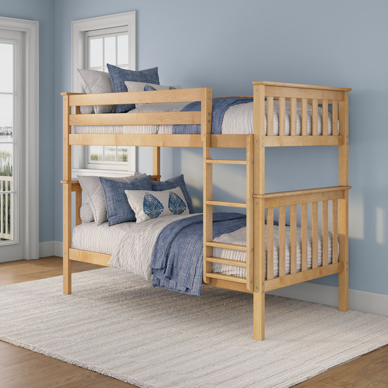 Light wood twin-over-twin bunk bed with blue and gray bedding in a coastal kids bedroom with large windows