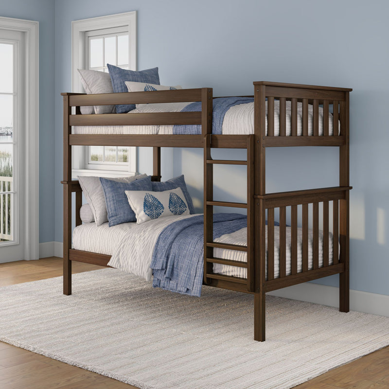 Dark wood bunk bed with ladder, white quilt and blue pillows in bright coastal bedroom