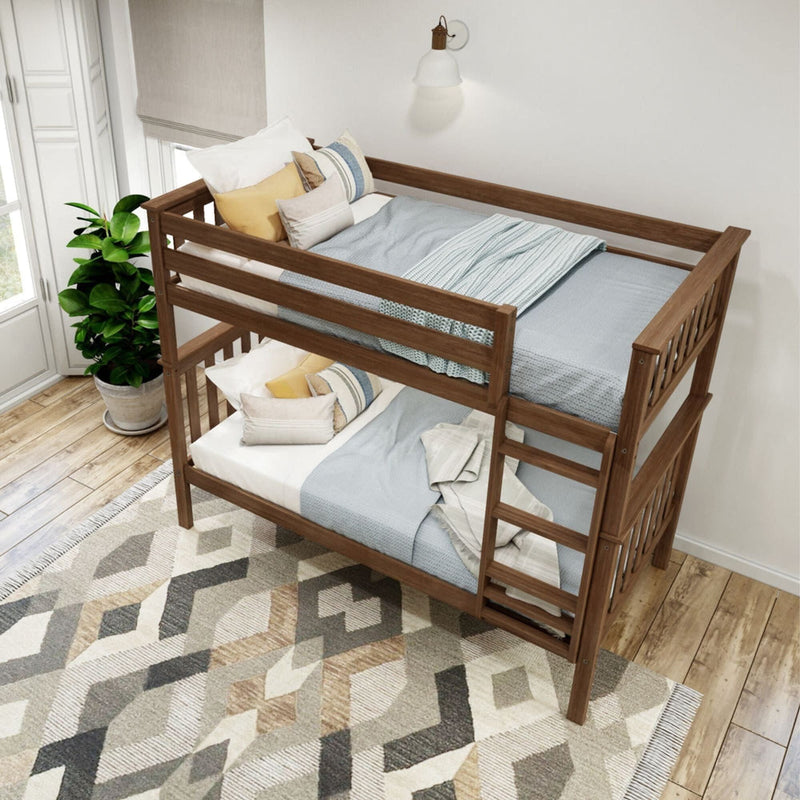 Wooden bunk bed with blue bedding in a cozy, modern bedroom featuring geometric rug and indoor plant.