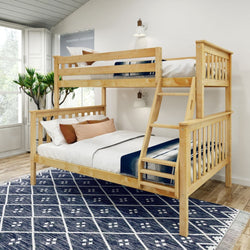 Wooden bunk bed in a modern bedroom with natural light and blue geometric rug.